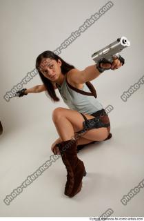 04 Shrima Kneeling Pose With Guns